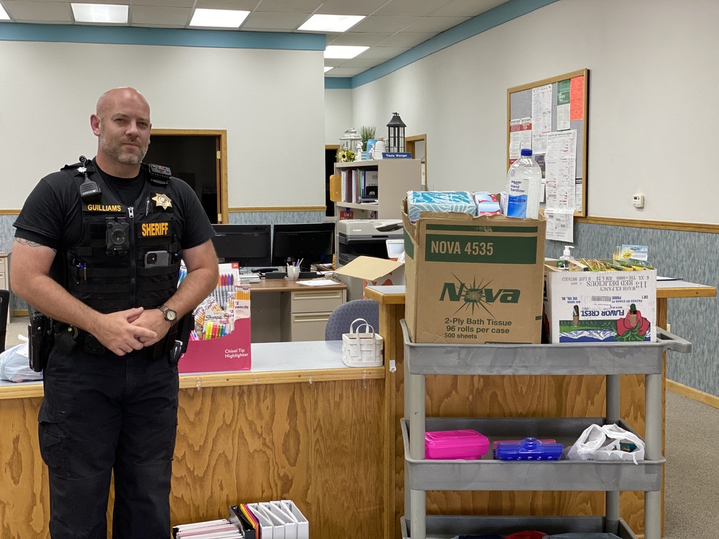 Brian Guilliams with the Brown County Sheriff's school supply donation.