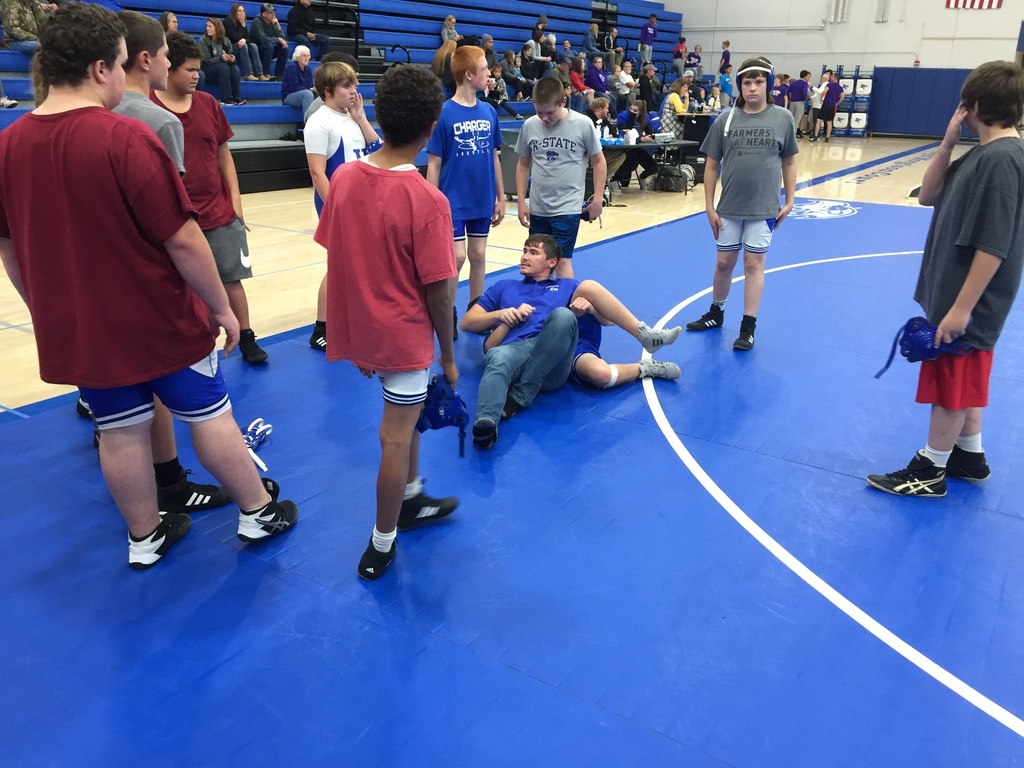 Coach Speer demonstrates for the team.
